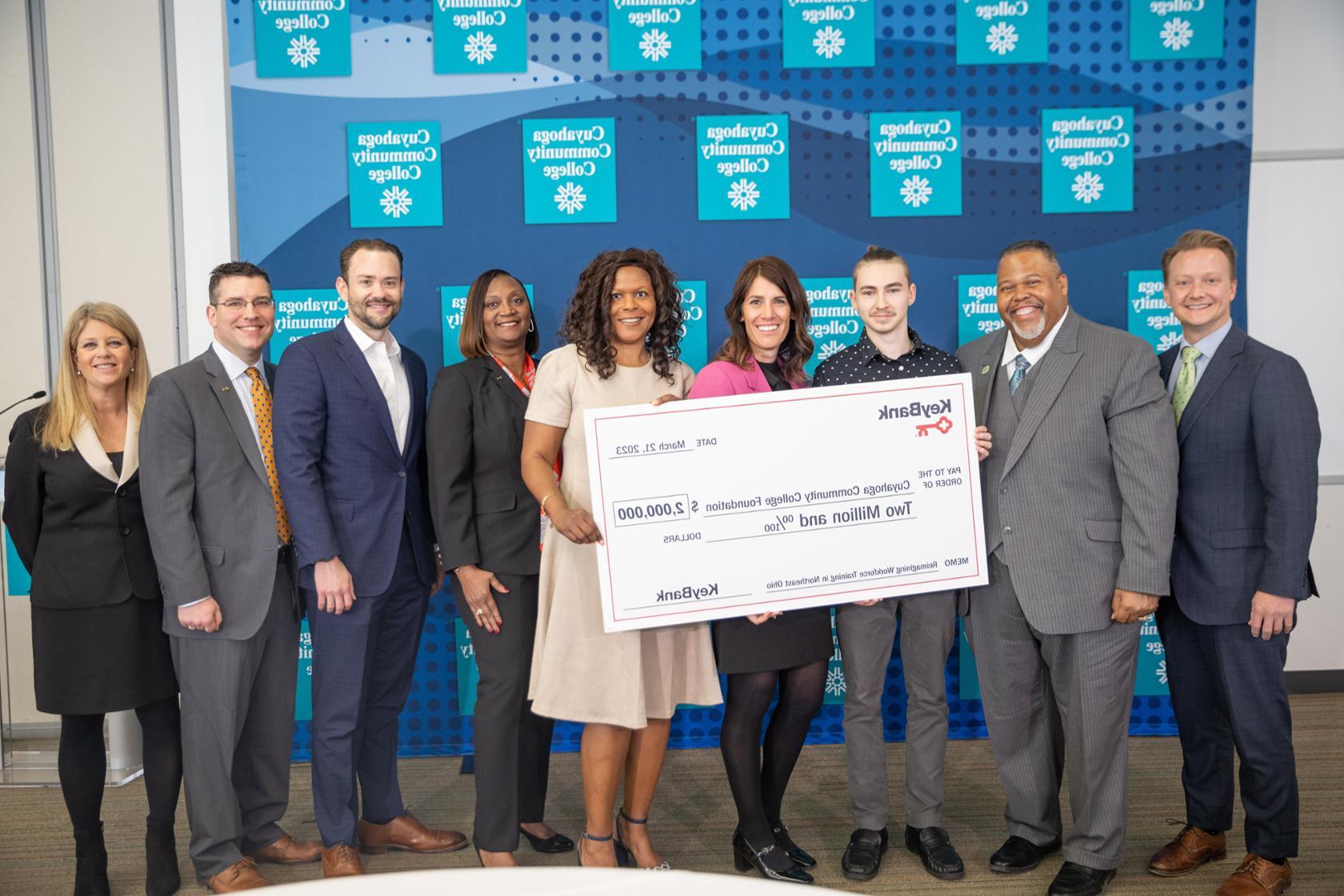 KeyBank and Tri-C leadership standing behind an oversized ceremonial check representing the two million dollar grant